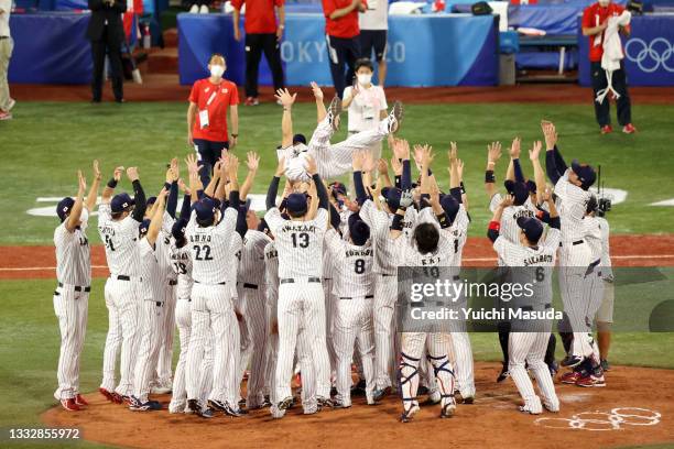 Head coach Atsunori Inaba of Team Japan is tossed into the air as they celebrate winning the gold after their 2-0 victory over Team United States in...