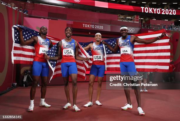 Bryce Deadmon, Michael Cherry, Michael Norman and Rai Benjamin of Team United States celebrate after winning the gold medal in the Men's 4 x 400m...