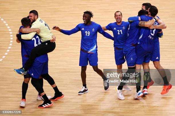 Team France celebrates defeating Team Denmark 25-23 to win the gold medal in Men's Handball on day fifteen of the Tokyo 2020 Olympic Games at Yoyogi...