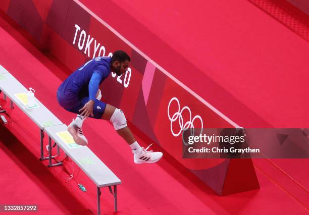 Earvin Ngapeth of Team France jumps over a bench as he competes against Team ROC during the Men's Gold Medal Match on day fifteen of the Tokyo 2020...