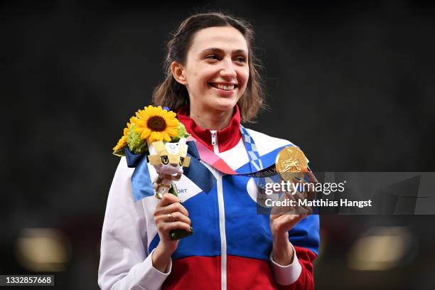 Gold medal winner, Mariya Lasitskene of Team ROC holds her medal on the podium during the medal ceremony for the Women's High Jump on day fifteen of...
