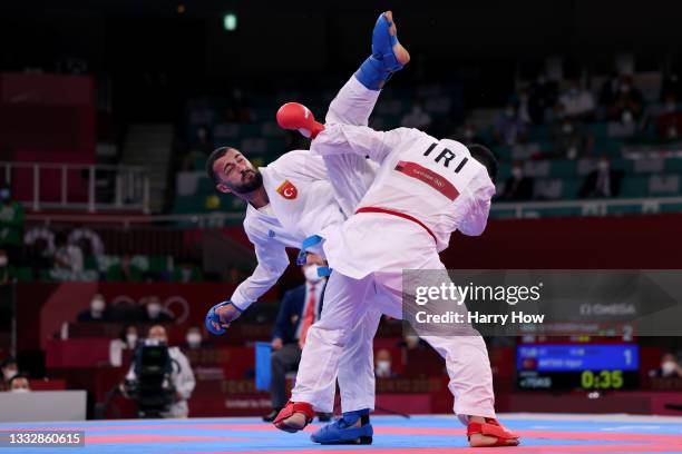 Ugur Aktas of Team Turkey competes against Sajad Ganjzadeh of Team Iran during the Men’s Karate Kumite +75kg Semifinal contest on day fifteen of the...