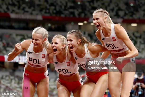 Natalia Kaczmarek, Iga Baumgart-Witan, Malgorzata Holub-Kowalik and Justyna Swiety-Ersetic of Team Poland celebrate after winning the silver medal in...