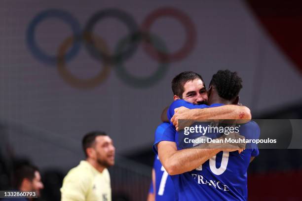 Nikola Karabatic embraces teammate Dika Mem of Team France after defeating Team Denmark 25-23 to win the gold medal in Men's Handball on day fifteen...