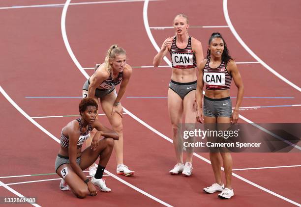 Alicia Brown, Madeline Price, Kyra Constantine and Sage Watson of Team Canada react after the Women's 4 x 400m Relay Final on day fifteen of the...