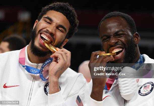 Jayson Tatum and Draymond Green of Team United States pose for photographs with their gold medals during the Men's Basketball medal ceremony on day...