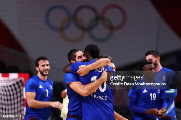 Nikola Karabatic embraces teammate Dika Mem of Team France after defeating Team Denmark 25-23 to win the gold medal in Men's Handball on day fifteen...