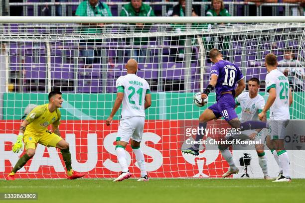 Maurice Trapp of Osnabrueck scores the first goal during the DFB Cup first round match between VfL Osnabrück and Werder Bremen at on August 07, 2021...