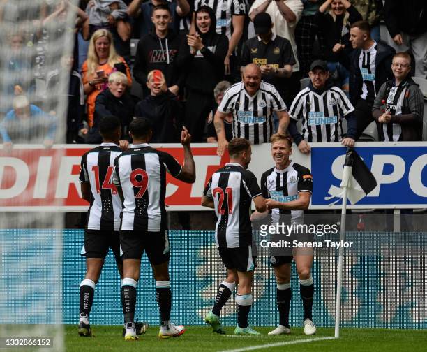 Matt Ritchie of Newcastle United FC celebrates with teammates after scoring the opening goal during the Pre Season Friendly between Newcastle United...
