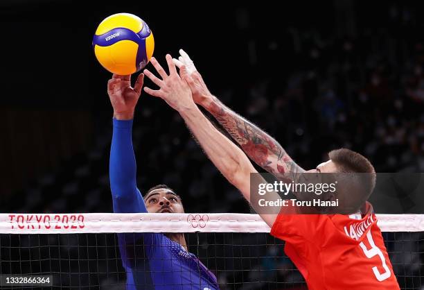 Earvin Ngapeth of Team France competes against Ivan Iakovlev of Team ROC during the Men's Gold Medal Match on day fifteen of the Tokyo 2020 Olympic...