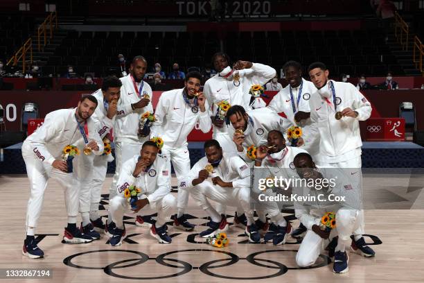 Team United States pose for photographs with their gold medals during the Men's Basketball medal ceremony on day fifteen of the Tokyo 2020 Olympic...