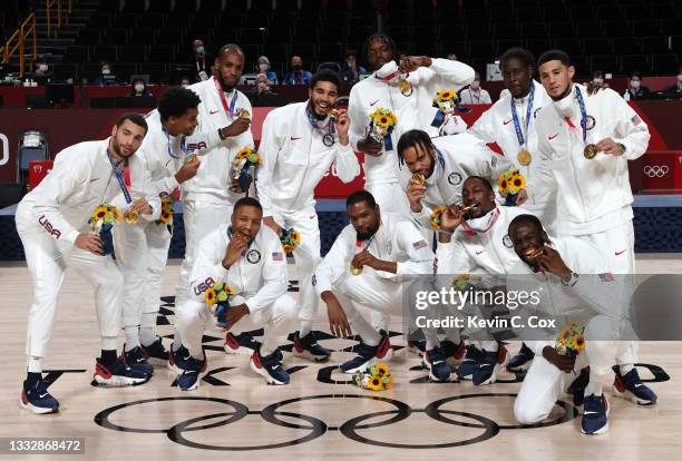 Team United States pose for photographs with their gold medals during the Men's Basketball medal ceremony on day fifteen of the Tokyo 2020 Olympic...