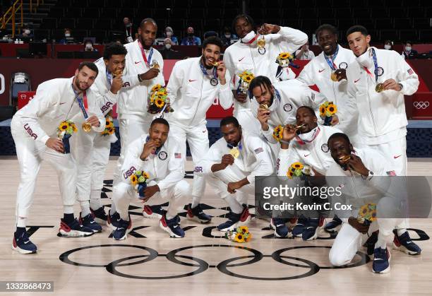 Team United States pose for photographs with their gold medals during the Men's Basketball medal ceremony on day fifteen of the Tokyo 2020 Olympic...