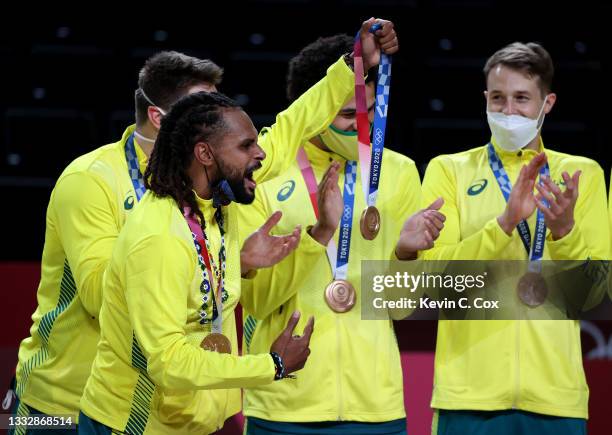Patty Mills of Team Australia celebrates with his bronze medal during the Men's Basketball medal ceremony on day fifteen of the Tokyo 2020 Olympic...