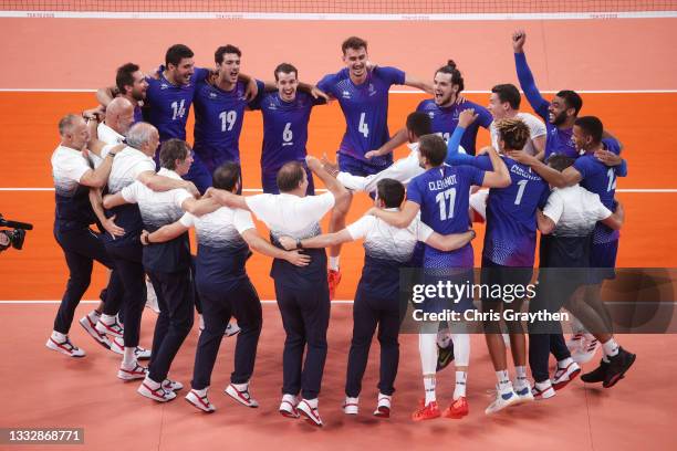 Players of Team France react after defeating Team ROC during the Men's Gold Medal Match on day fifteen of the Tokyo 2020 Olympic Games at Ariake...