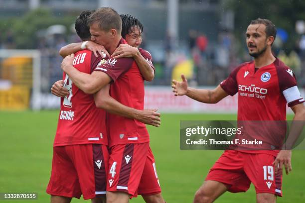 Alessandro Schoepf, Joakim Nilsson, Masaya Okugawa and Manuel Prietl of Bielefeld celebrate during the DFB Cup first round match between SpVgg...