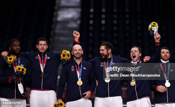 Gold medalists Team France react with their gold medals during the medal ceremony for Men's Handball on day fifteen of the Tokyo 2020 Olympic Games...