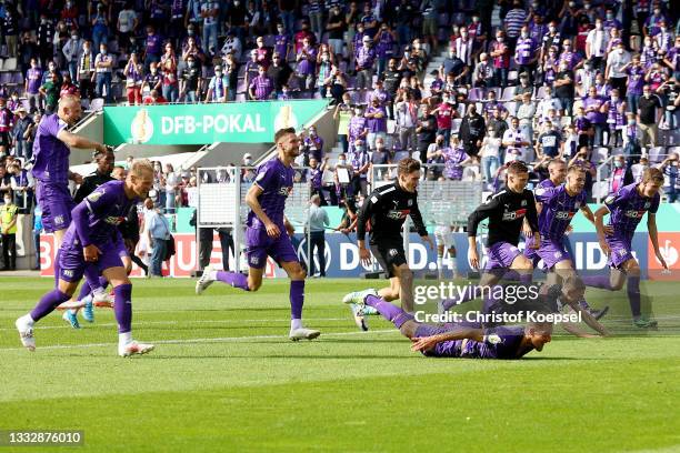 The team of Osnabrueck celebrates after winning 2-0 the DFB Cup first round match between VfL Osnabrück and Werder Bremen at on August 07, 2021 in...