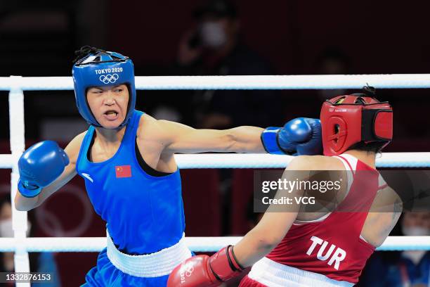 Busenaz Surmeneli of Team Turkey competes against Hong Gu of Team China during the Women's Welter Final bout on day fifteen of the Tokyo 2020 Olympic...