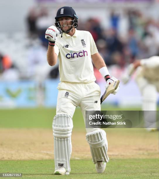 Joe Root of England celebrates after scoring 100 runs during day four of the First Test Match between England and India at at Trent Bridge on August...