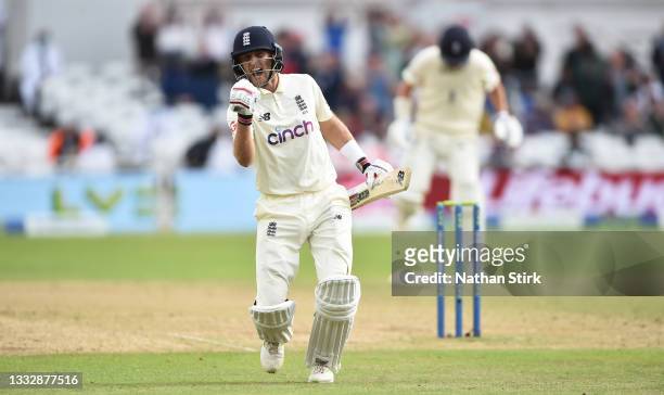 Joe Root of England celebrates after scoring 100 runs during day four of the First Test Match between England and India at at Trent Bridge on August...