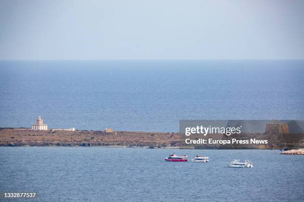 Several boats sail in front of the Tabarca Lighthouse, on 02 August, 2021 in Tabarca Island, Alicante, Spain. As every August 7 is celebrated the...