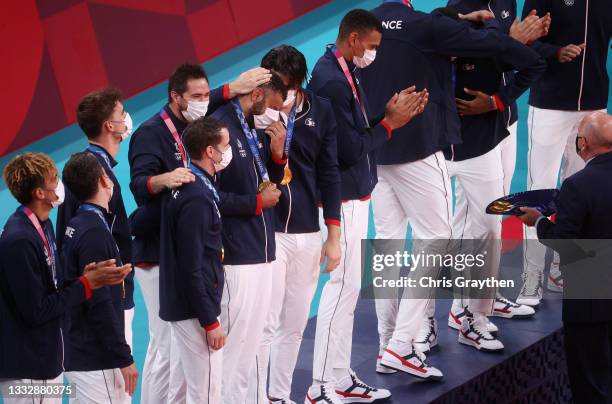 Earvin Ngapeth of Team France reacts with team mates as they receive their Gold Medals during the Victory Ceremony following the Men's Gold Medal...