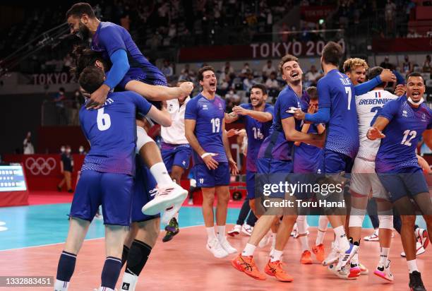 Earvin Ngapeth of Team France reacts with team mates after defeating Team ROC during the Men's Gold Medal Match on day fifteen of the Tokyo 2020...