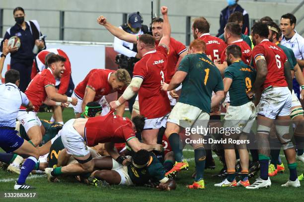 Players of British & Irish Lions celebrate their side's first try scored by Ken Owens during the 3rd Test Match between South Africa and British &...