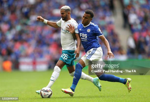 Riyad Mahrez of Manchester City is challenged by Ryan Bertrand of Leicester City during The FA Community Shield Final between Manchester City and...