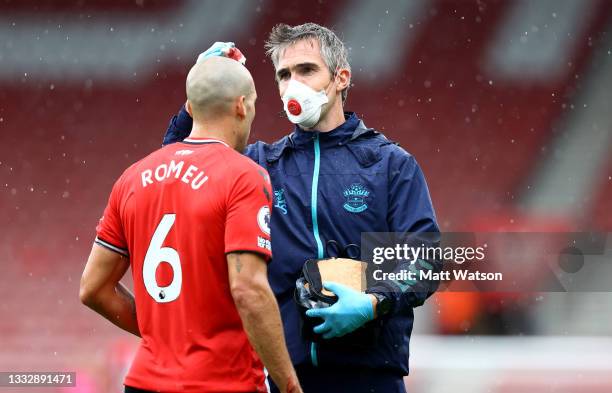 Oriol Romeu of Southampton receives treatment from Club Doctor Inigo Sarriegui during the pre season friendly match between Southampton FC and...