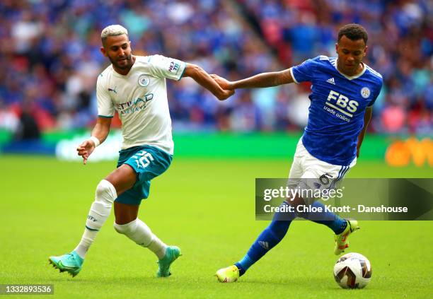 Riyad Mahrez of Manchester City and Ryan Bertrand of Leicester City in action during the The FA Community Shield between Manchester City and...