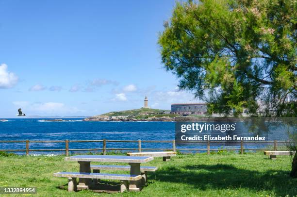 promenade of a coruna, in the background the torre de hercules - a coruna stock pictures, royalty-free photos & images