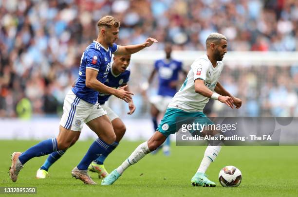 Riyad Mahrez of Manchester City runs with the ball whilst under pressure from Kiernan Dewsbury-Hall of Leicester City during The FA Community Shield...