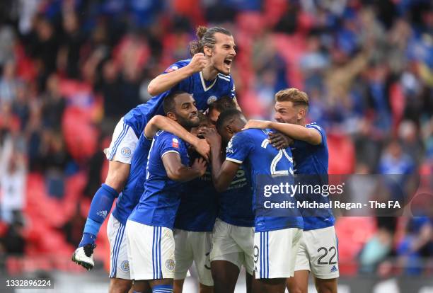 Kelechi Iheanacho of Leicester City celebrates with Caglar Soeyuencue and team mates after scoring their side's first goal during The FA Community...