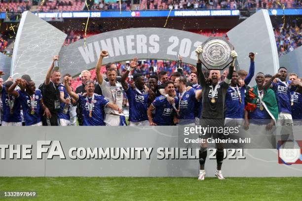 Kasper Schmeichel of Leicester City lifts The FA Community Shield as his team mates celebrate following victory in The FA Community Shield Final...