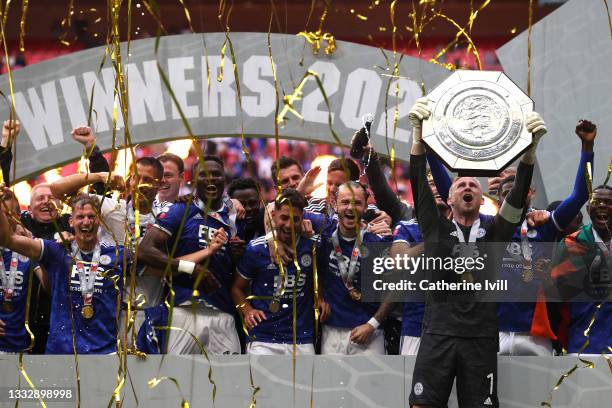 Kasper Schmeichel of Leicester City lifts The FA Community Shield as his team mates celebrate following victory in The FA Community Shield Final...