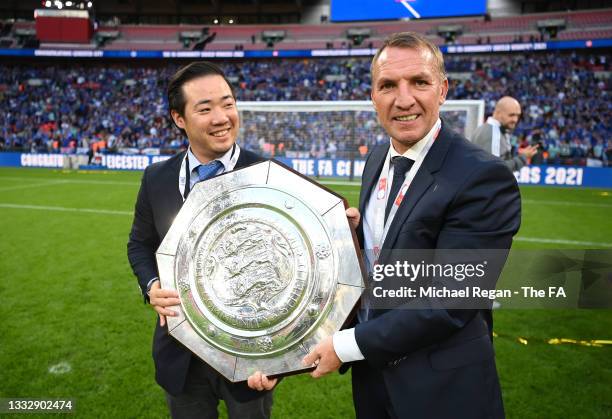 Khun Top, Chairman of Leicester City and Brendan Rodgers, Manager of Leicester City pose with The FA Community Shield following victory in The FA...