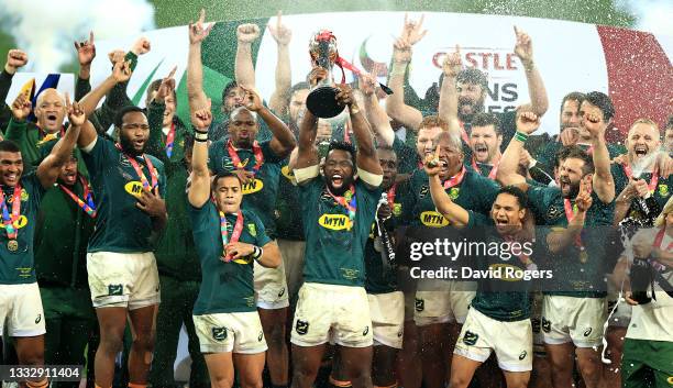 Siya Kolisi, the South Africa Springboks captain raises the trophy as his team celebrate their victory during the 3rd test match between the South...