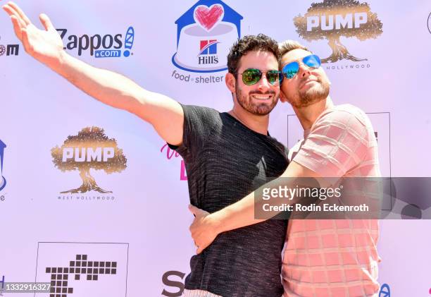 Michael Turchin and Lance Bass arrive at the 5th Annual World Dog Day at West Hollywood Park on August 07, 2021 in West Hollywood, California.