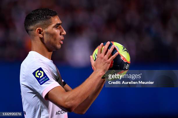 Achraf Hakimi of Paris Saint-Germain looks on during the Ligue 1 football match between Troyes and Paris at Stade de l'Aube on August 07, 2021 in...