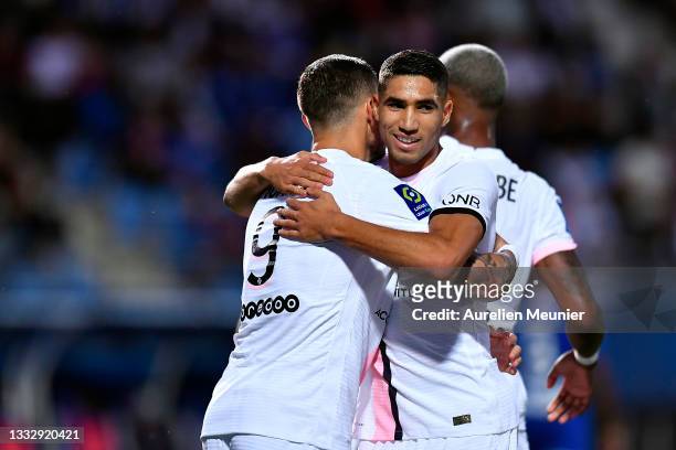 Mauro Icardi of Paris Saint-Germain is congratulated by teammate Achraf Hakimi after scoring during the Ligue 1 football match between Troyes and...