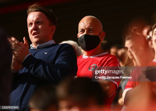 Charlton Athletic fans wears a face covering during the Sky Bet League One match between Charlton Athletic and Sheffield Wednesday at The Valley on...