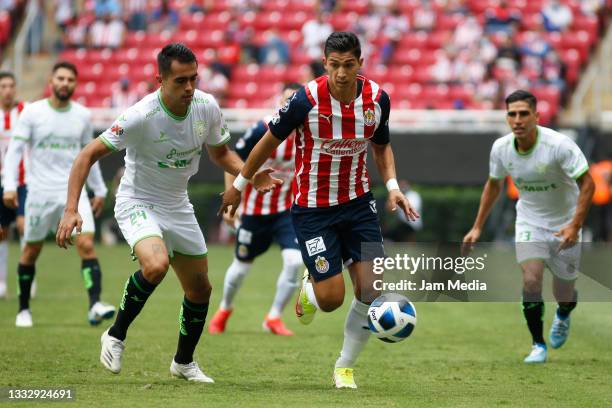 Jose Juan Garcia of Juarez fights for the ball with Angel Zaldivar of Chivas during the 3rd round match between Chivas and Juarez as part of the...