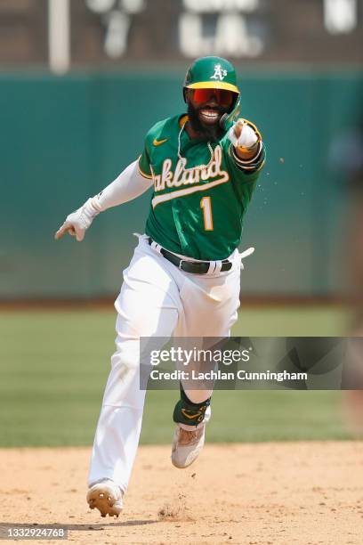 Josh Harrison of the Oakland Athletics celebrates after hitting a two-run home run in the bottom of the fifth inning against the Texas Rangers at...