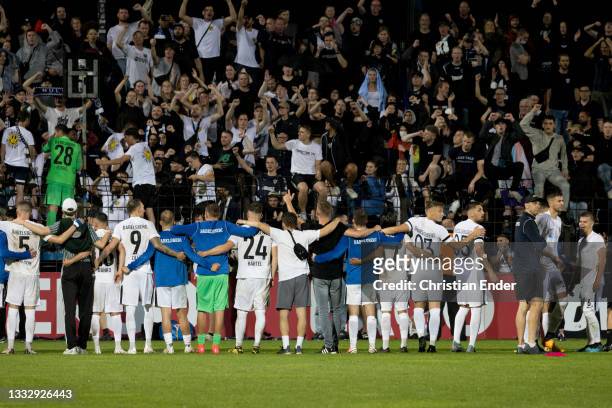Fans and the team of SV Babelsberg 03 celebrate after winning 5-4 after penalties the DFB Cup first round match between SV Babelsberg 03 and SpVgg...