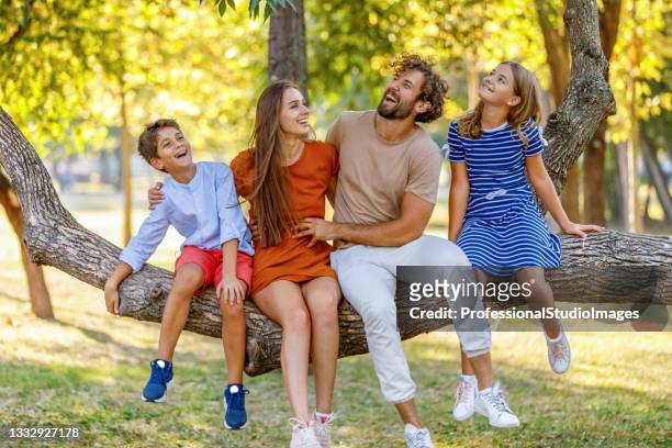 happy family has a lot of enjoyment in nature. - preteen model stock pictures, royalty-free photos & images