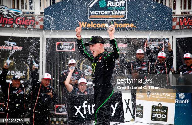 Ty Gibbs, driver of the Monster Energy Toyota, celebrates in the Ruoff Mortgage victory lane after winning the NASCAR Xfinity Series Skrewball Peanut...