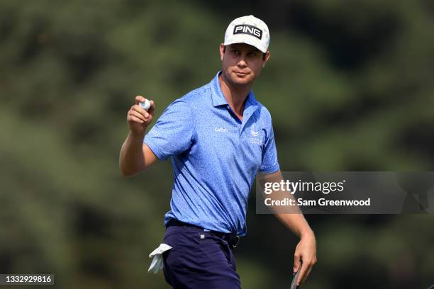 Harris English acknowledges the crowd on the 16th hole during the third round of the World Golf Championship-FedEx St Jude Invitational at TPC...