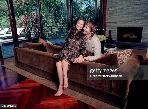 Actors Ashton Kutcher and Demi Moore are photographed at home for Architectural Digest on October 19, 2006 in Beverly Hills, California.